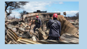 Members of FEMA urban search and rescue teams go through destroyed neighborhoods in Lahaina, Hawaii,